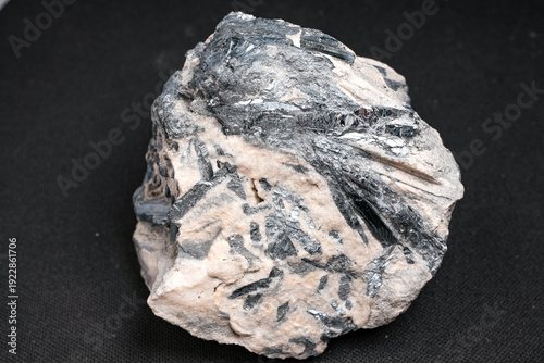 фотографія Black metallic crystal cluster in pale host rock