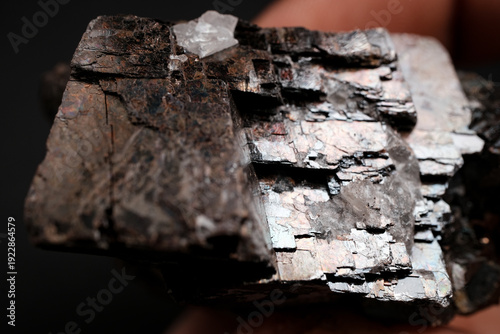 Metallic layered mineral specimen close-up