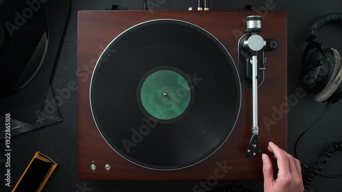Audiophile Playing a Vinyl Record - Turning on the Turntable, Positioning and Lowering the Tonearm Using a Cue Lever - Top View