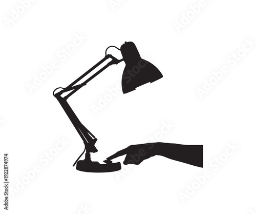 Hand turning on desk lamp with bright blue light.