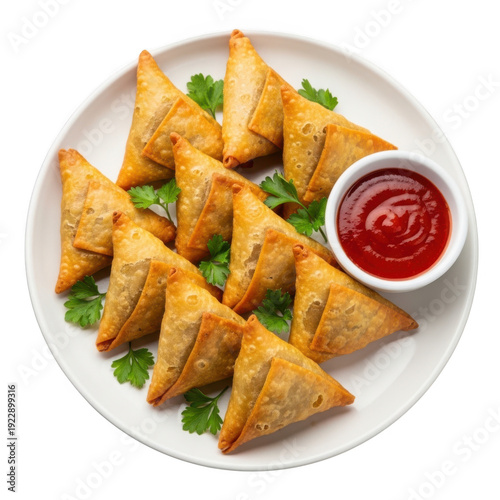 A plate of samosas with a side of ketchup