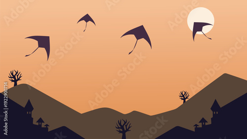 Kites Flying Over Silhouette Hill Landscape at Sunset