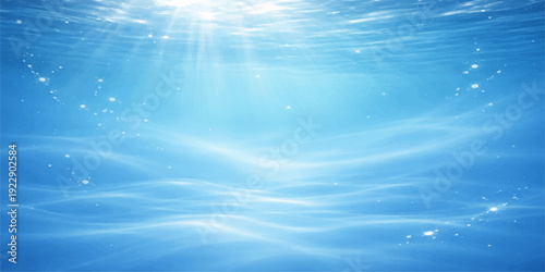 An abstract blue background where the summer sun reflects off liquid ocean waves under a beautiful cloud-filled sky and horizon landscape