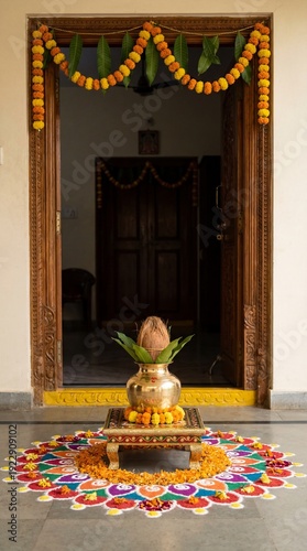 Traditional Indian welcome decoration with Kalash, coconut, mango leaves, colorful rangoli, and marigold garland at a home entrance for festive celebrations and cultural events.
