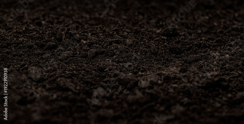 Schilderij op canvas Dark brown soil texture for gardening and growth backgrounds