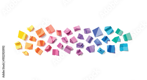 Horizontal arrangement of colorful geometric paper shapes, including cubes and cuboids, forming a rainbow gradient.