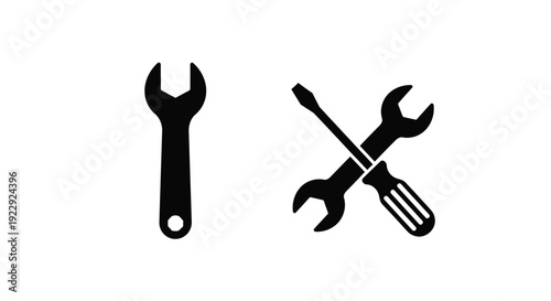 Black and white illustration of a wrench screwdriver and adjustable wrench