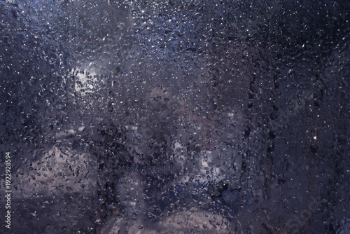 A window with a frosted glass that has a blurry background