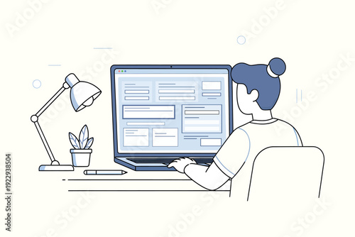 A woman working on a laptop at a desk with a lamp and plant