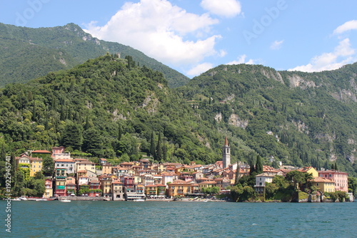 Picturesque village of Varenna seen from Lake Como on sunny day, Lombardy, Italy.