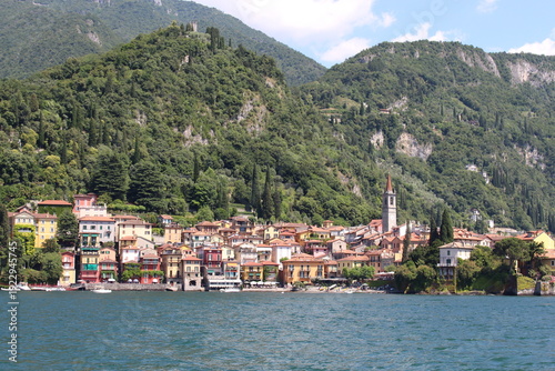 Picturesque village of Varenna seen from Lake Como on sunny day, Lombardy, Italy.