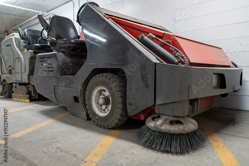 Photography Industrial Cleaning Machine Parked Indoors, Ready for Floor Maintenance in a Com