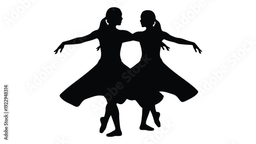 Silhouette of two young girls dancing arms outstretched in flowing dresses