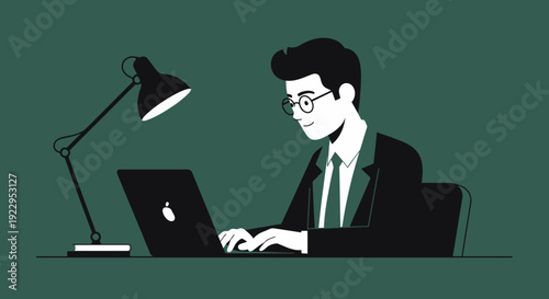 Focused businessman working diligently on a laptop at his desk with a desk lamp illuminating the workspace.