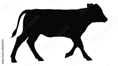 A black silhouette of a cow standing in profile against a white background
