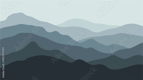 Mist covered blue mountain ranges in receding perspective background