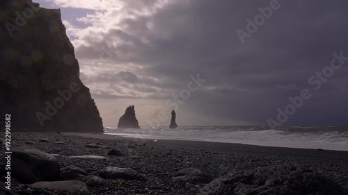 Basalt columns and waves at Reynisfjara Beach during changing weather