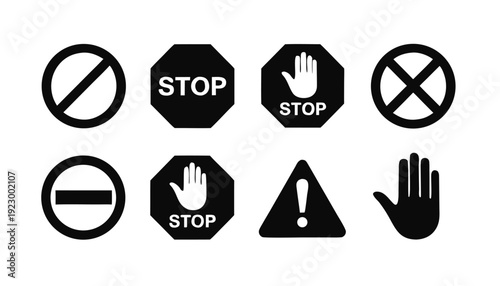 Set of eight black and white prohibition and warning signs including stop hand and exclamation mark
