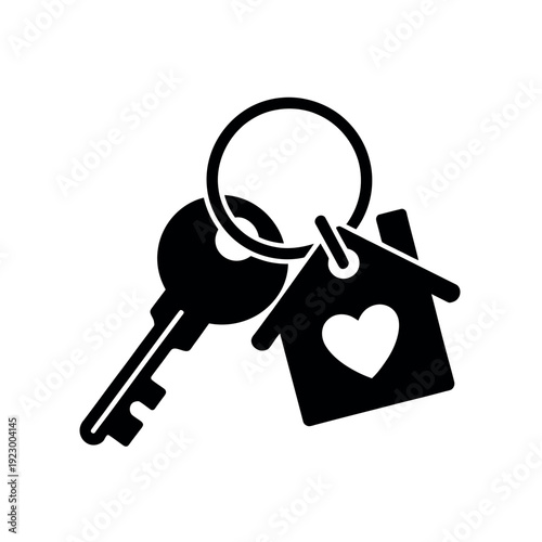 House key with a heart-shaped fob symbolizes home ownership and security access.
