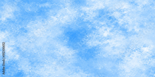 A beautiful clear blue sky background featuring fluffy white clouds in a natural summer landscape atmosphere with sunny light and an abstract cloudscape