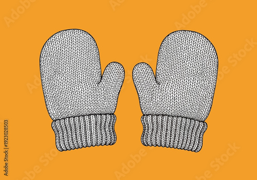 Pair of knitted mittens on orange background.