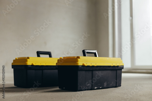 Two Closed Tool Cases With Handles And Latches Positioned Side By Side.