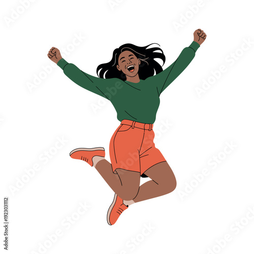 A young woman jumping in the air with excitement and joy