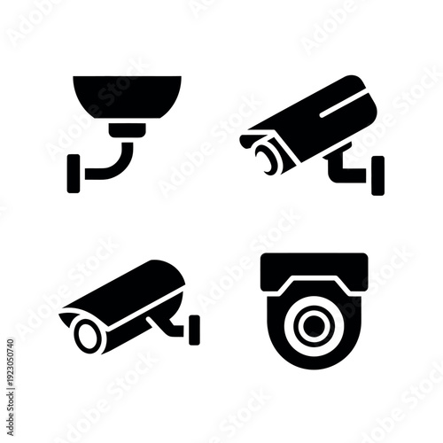 A set of four black and white security camera icons