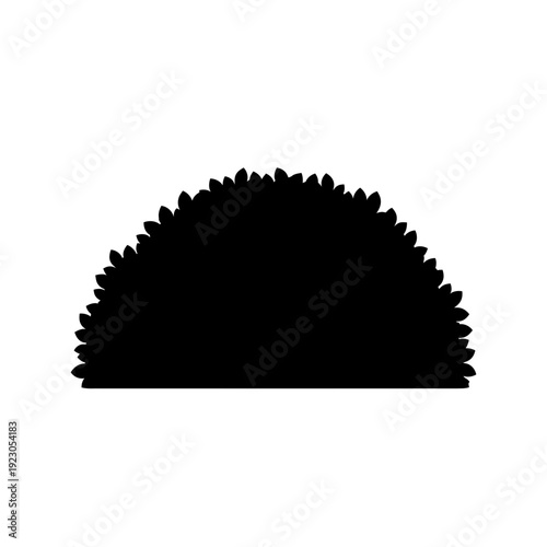 Silhouette of a semicircular green bush.