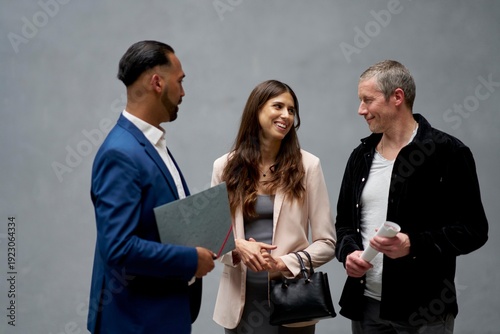 Agent and clients in a friendly and communicative meeting