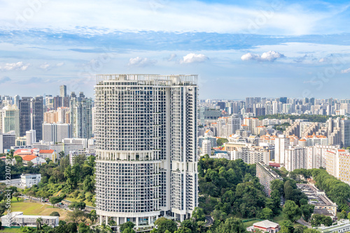 Modern developing residential district with tall skyscrapers and green park in the foreground, Singapore city