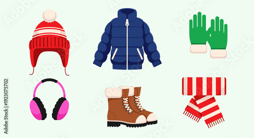Winter clothing and accessories on light green background