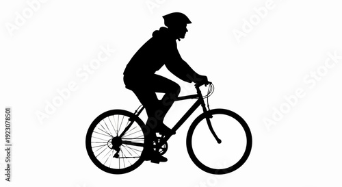 Silhouette of cyclist riding bicycle.