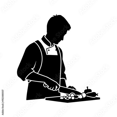 A black silhouette of a chef in an apron and jacket, meticulously chopping various vegetables on a cutting board with a knife.
