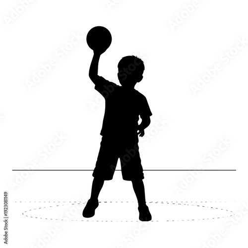 Silhouette of a young boy holding a ball above his head, ready to play a sport or game.