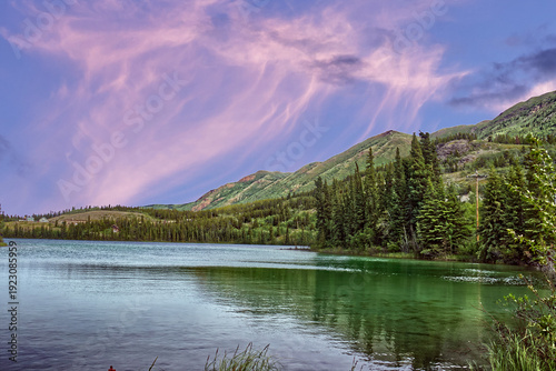 Rolling hills and grasslands by the Emerald Lake, at sunset. YT, Canada