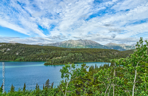 Beautiful cloud pattern over the snow scattered mountains surrounding the Emerald Lake, YT, Canada
