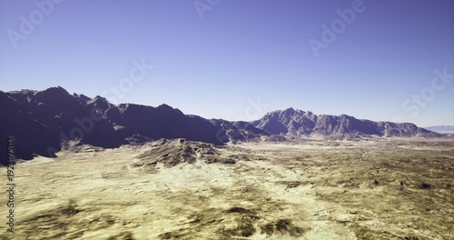 Tableau sur toile wide sunlit valley with mountain ridge, warm golden hour tones, dramatic shadow
