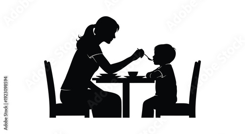 A mother lovingly feeding her young child at a dining table depicted in a striking black silhouette high quality professional detailed