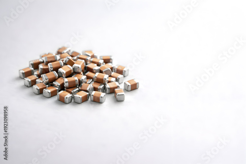 SMD Ceramic Capacitors (MLCC) Pile on White Background with Copy Space