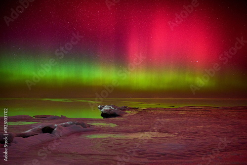 Vibrant Aurora Borealis Over Icy Lubmin Coast