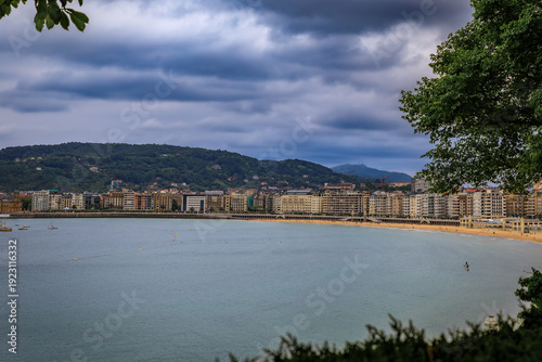 Panorama of La Concha bay, beach and waterfront hotels in San Sebastian, Spain