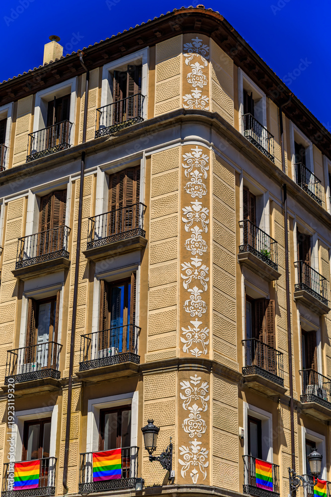 Obraz premium Beautiful traditional residential buildings with metal balconies in the streets of the city center in Madrid, Spain