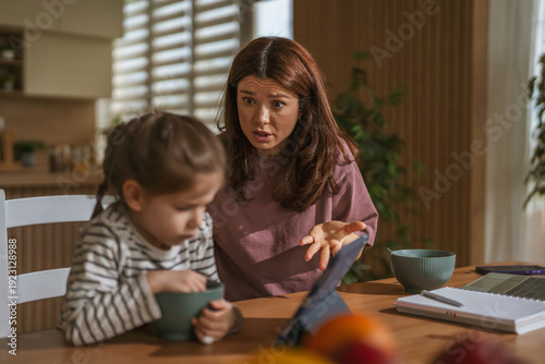 Fotografie Mother scolding child for misbehavior in a domestic argument