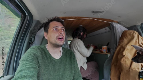 Man vlogging van life lifestyle with woman cooking
