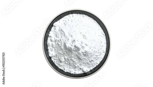 Overhead shot of a small dark bowl filled with white, fine powder against a black backdrop