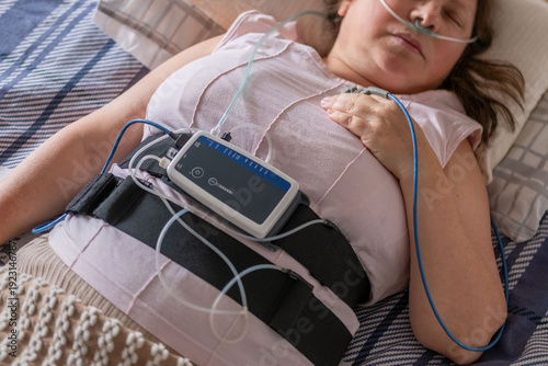 Bild auf Leinwand Patient undergoing clinical sleep study diagnostic sensors, woman sleeping with