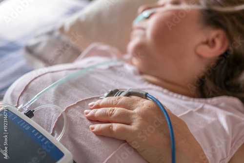 Tableau sur toile Patient undergoing clinical sleep study diagnostic sensors, woman sleeping with