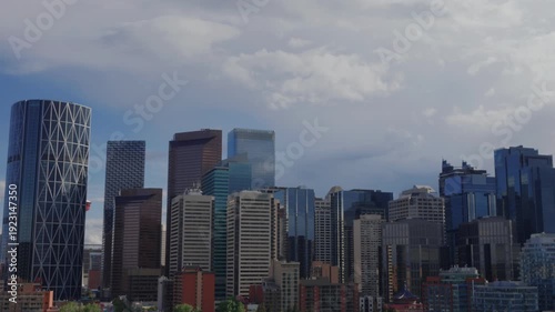 Wallpaper Mural Calgary city skyline featuring urban architecture and modern skyscrapers against a cloudy sky Torontodigital.ca