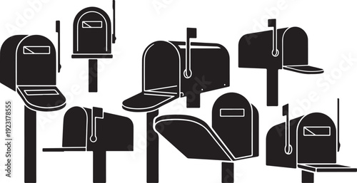 Collection of various mailboxes on posts in black and white